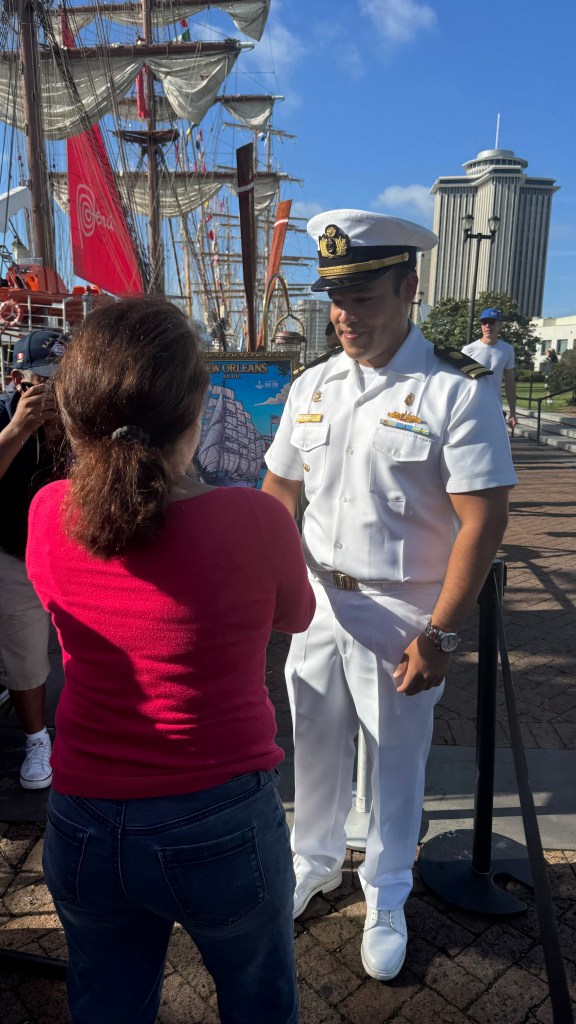A Peruvian Naval Officer welcomes the first woman aboard the B.A.P. Union at Sail250 New Orleans on Saturday, May 30
