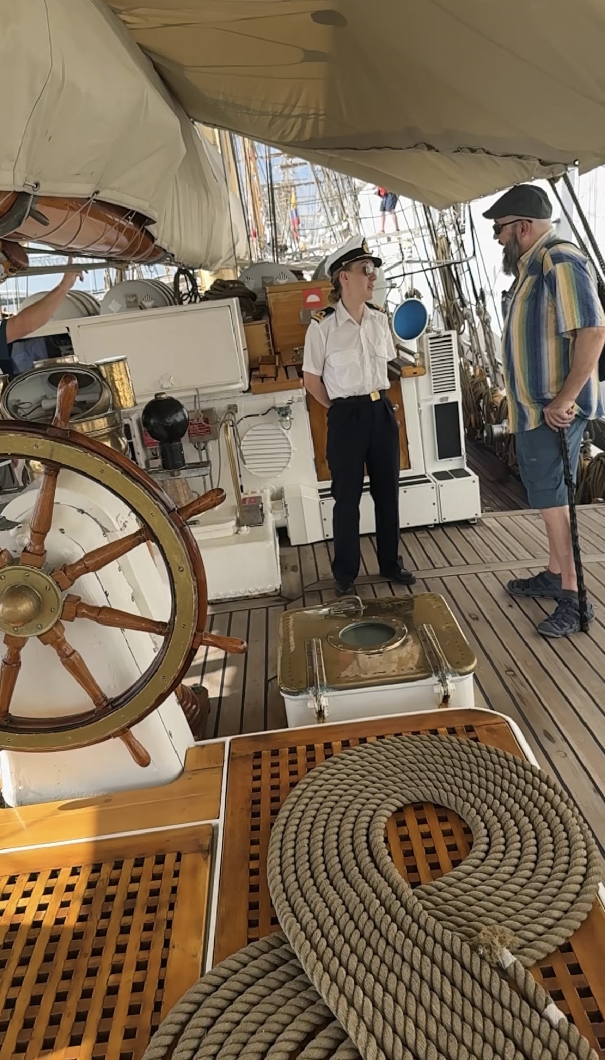 A man speaking to a female Swedish Naval person on the Gladan - Swedish Ship