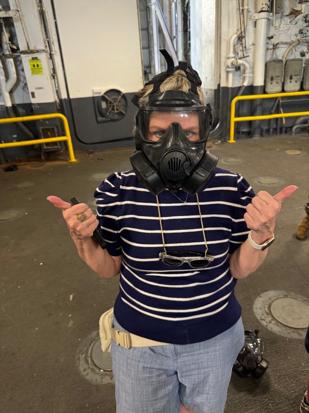 A woman wearing a gas mask