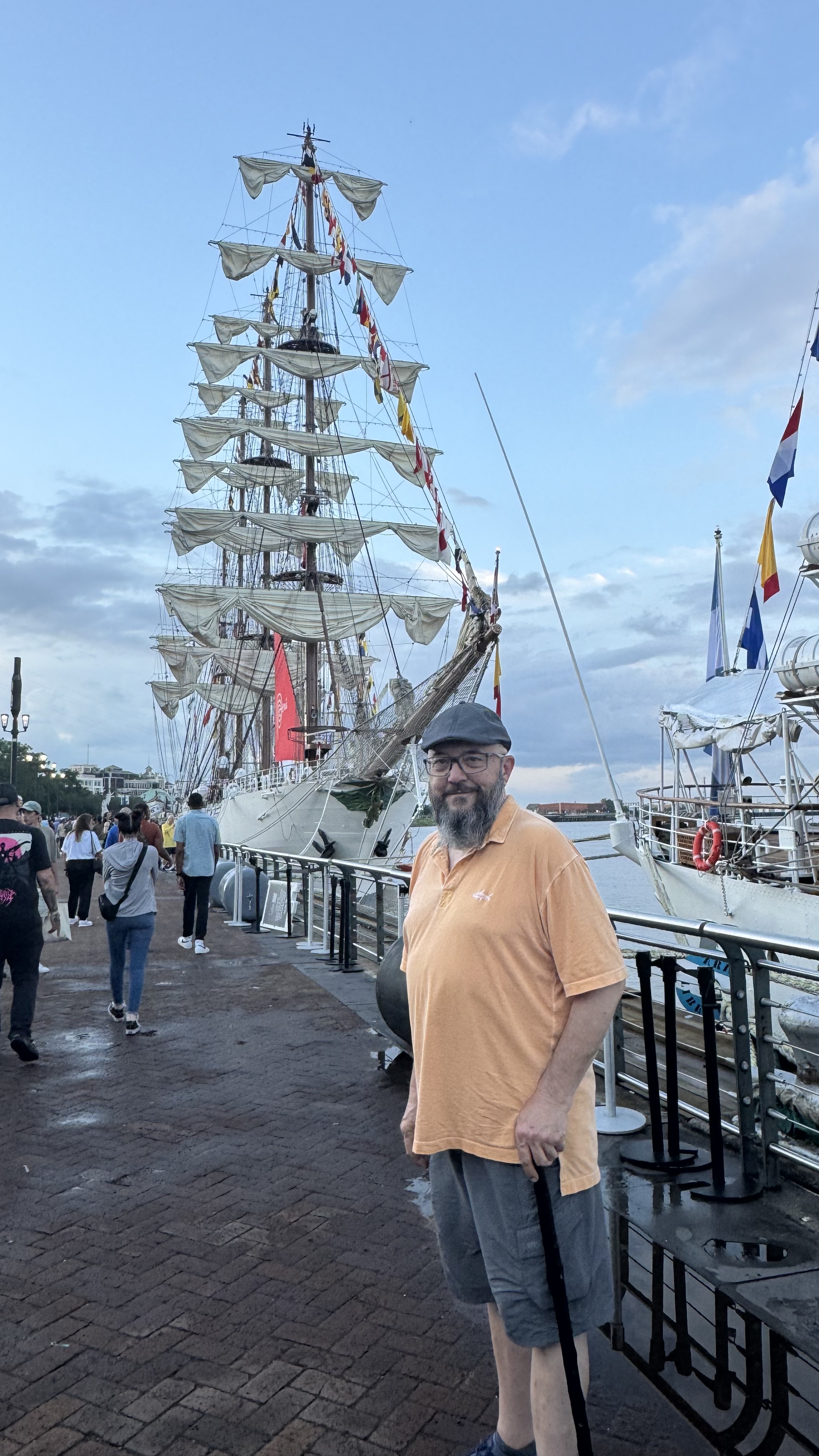 a man standing in front of the B.A.P. Union - a Peruvian Tall Ship