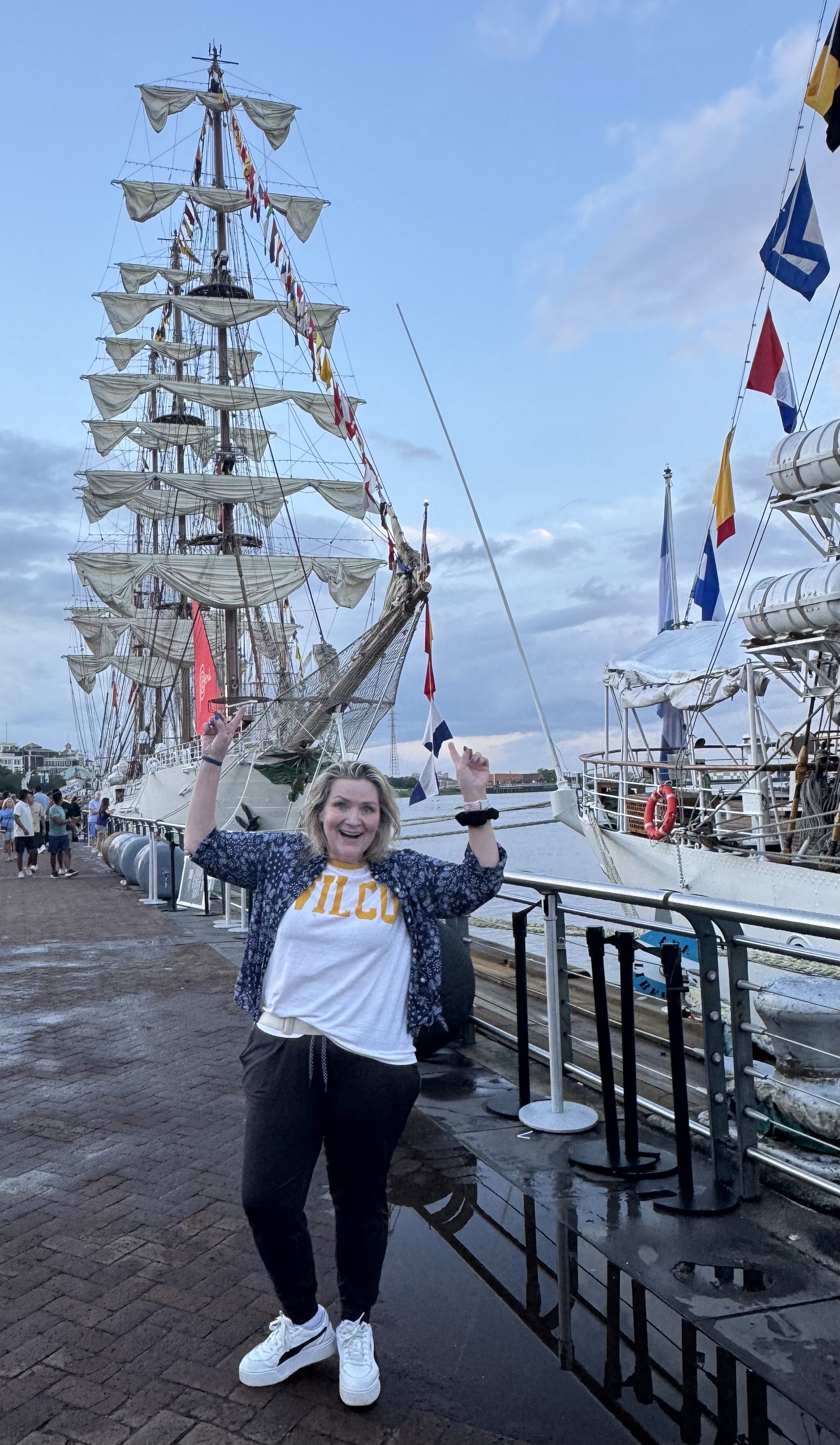 a woman standing in front of the B.A.P. Union - a Peruvian Tall Ship