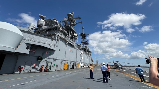 People touring the flight deck of the USS Kearsarge
