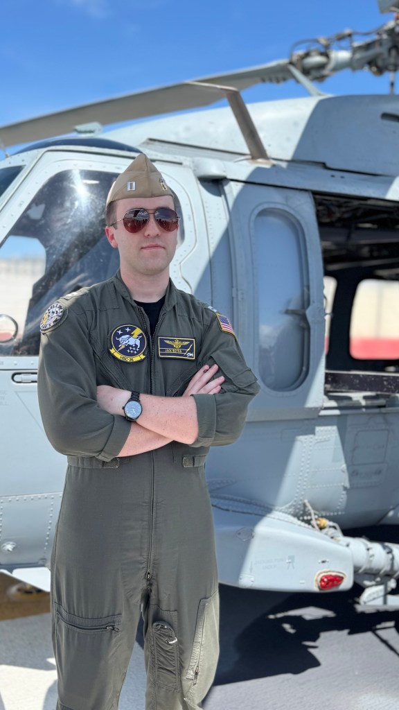 a naval pilot on the flight deck of the USS Kearsarge