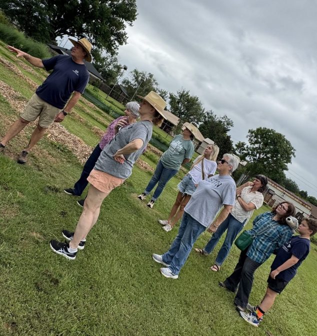 Lee Dutoce leading a farm tour through organic growing fields at Raccoon Bend Farms.